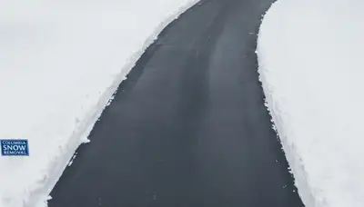 Clean residential driveway after professional snow removal by Chop Chop Landscaping in Columbia, MO